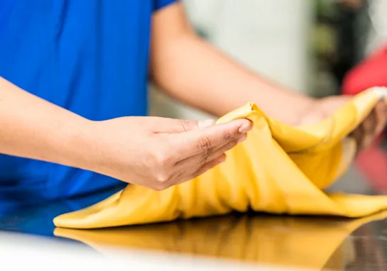 Laundry Worker Yellow Shutterstock 2045757611